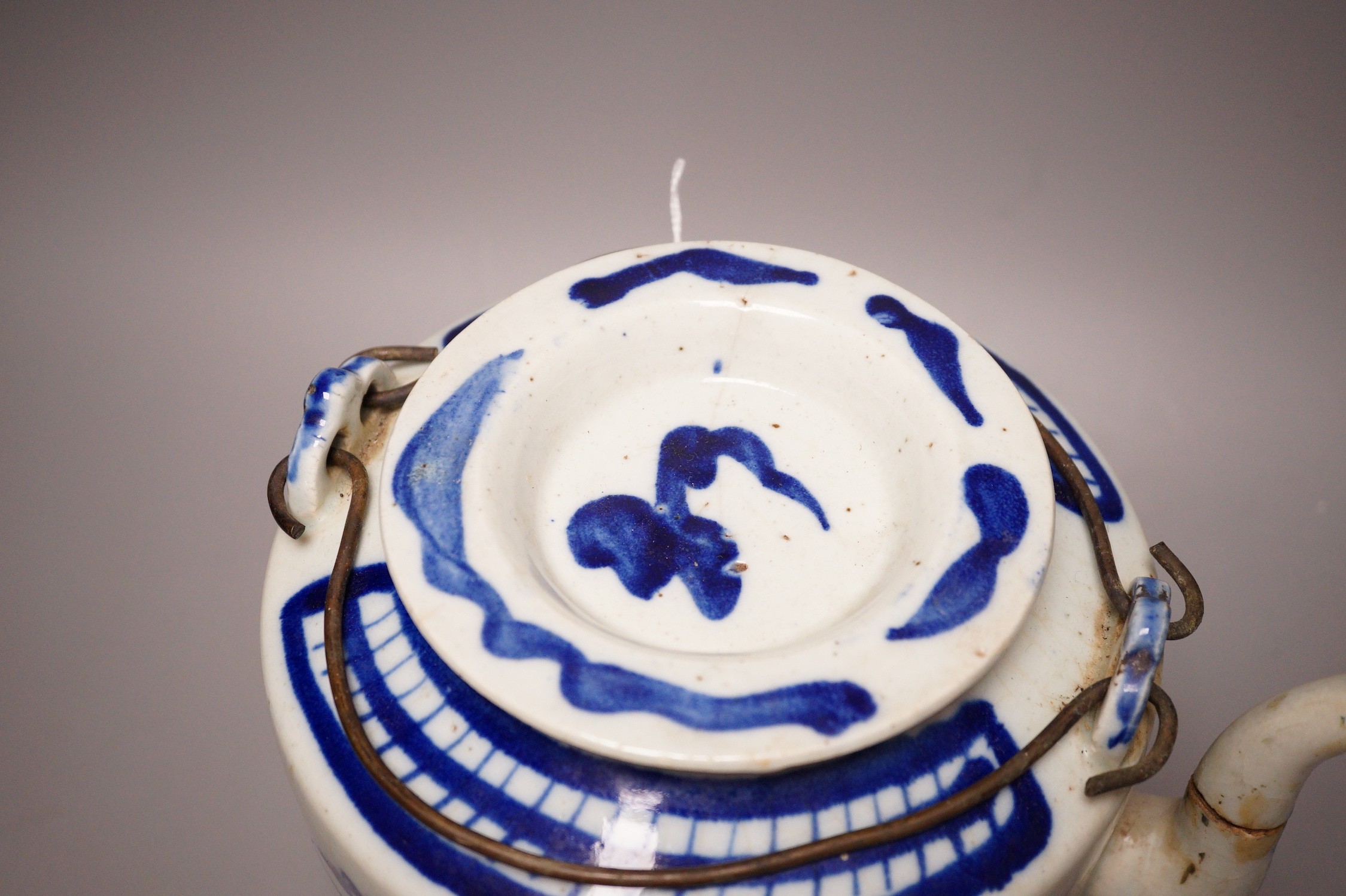A Chinese provincial blue and white teapot, 23cm